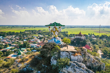 Fototapeta Aerial view of Wat Khao Samo Khon temple, with hanuman monkey god statue on top of mountain, in Lopburi, Thailand obraz