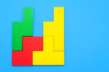 Colored puzzles are arranged in the correct order. the concept of order or rule