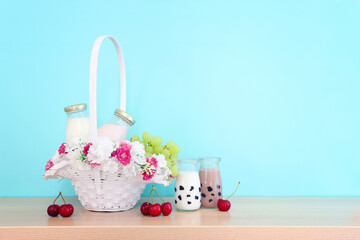 Photo of dairy products over wooden table. Symbols of jewish holiday - Shavuot