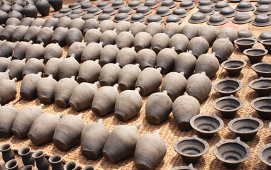 Traditional nepalese souvenirs - handmade clay jugs, dishes, bowls
