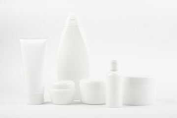 Set of different body creams, moisturizer on a white background