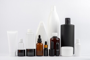 set of black and white cosmetics against white background