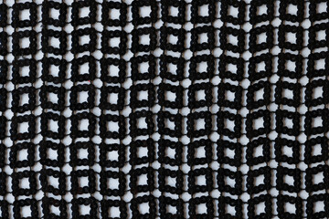 Abstract geometric monochrome braided pattern with square lines