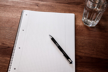 VISION stock image pen and paper with glass of water