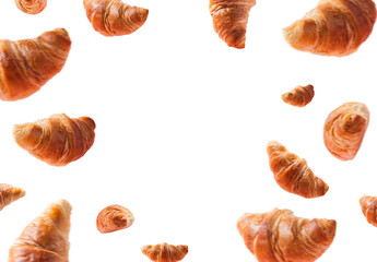 Many fresh baked croissants levitating or flying. Croissants isolated on white background with copy...