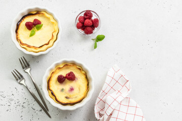 Cottage cheese casserole pudding with berries. Top view, copy space, flat lay.