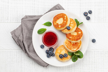 Cottage pancakes with jam and berries