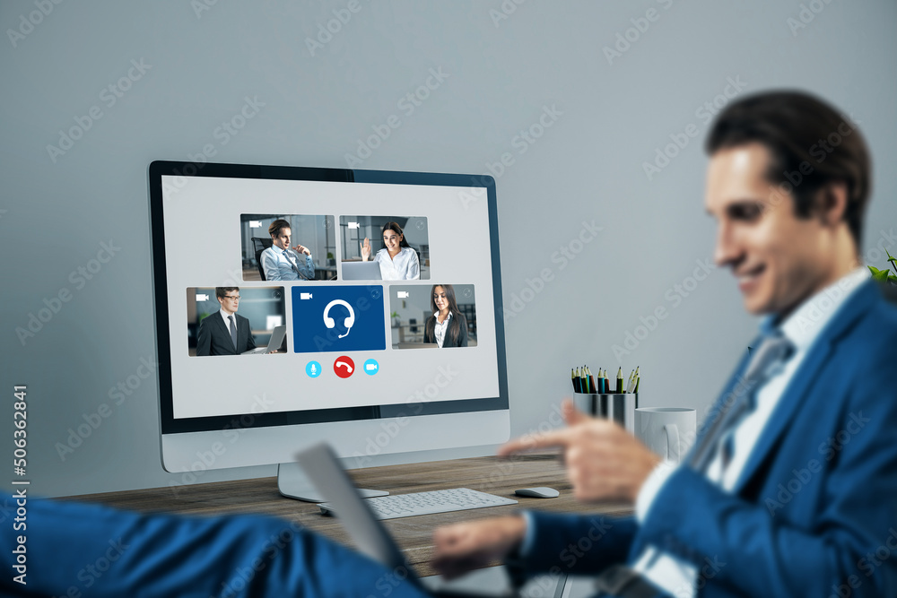 Poster blurry young european businessman using laptop computer with creative video conference call on scree