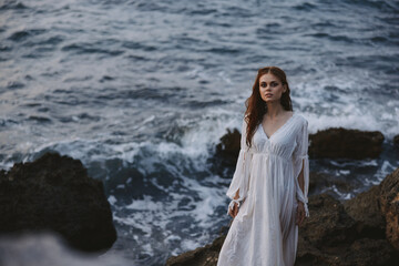 Woman in white dress nature rocky stones waves