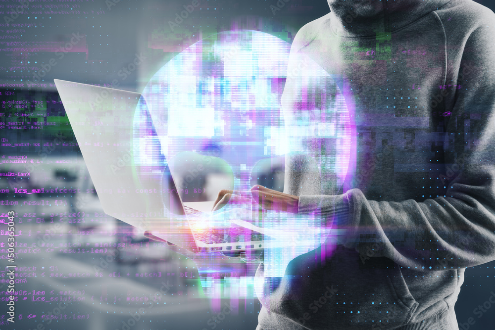 Poster hacker hands using laptop with abstract digital skull hologram on blurry office interior background.