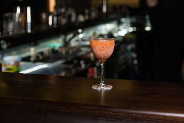 orange cocktail on bar