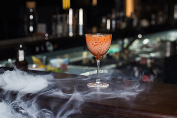 orange cocktail with smoke