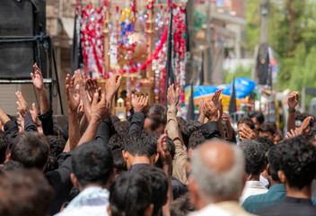 Ashura islamic holy day for shia muslims; mourning azadari rituals. Remembrance ceremonies for martyrdom of Imam Hussain. Ritual self-flagellation with hands