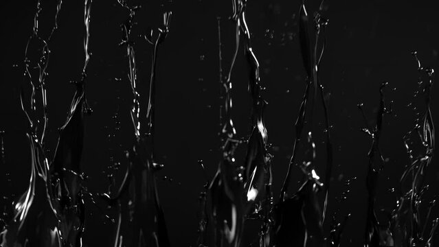 Super Slow Motion Shot of Black Glossy Paint Splash at 1000 fps.