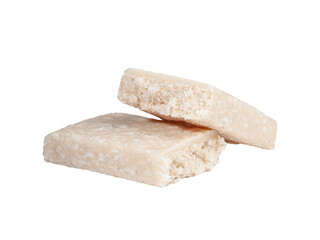 Protein bar with coconut cut into two parts. Close-up. White background. Isolated.
