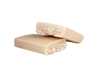 Protein bar with vanilla cut into two parts. Close-up. White background. Isolated.