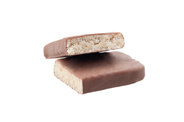 Protein bar with milk chocolate glaze. Taste of coconut. Cut into two pieces. Close-up. White background. Isolated.