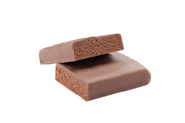 Protein bar with milk chocolate glaze. Brownie flavor. Cut into two pieces. Close-up. White background. Isolated.