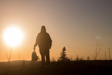 Fototapeta na wymiar silhouette of a person walking on the sunset