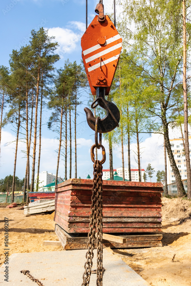 Poster crane hook for lifting loads. lifting device for stacking cargo. lifting and moving heavy loads on a