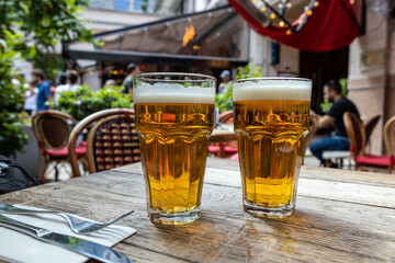 Coups of beer over restaurant table, Budapest - obrazy, fototapety, plakaty