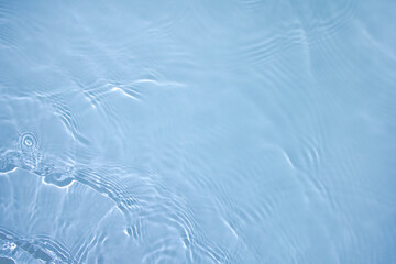 Transparent blue clear water surface texture with ripples, splashes and bubbles. Abstract nature...