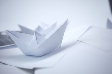 business concept, paper boats on the documents