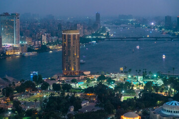 Egypt, Cairo, Gezira district with luxury hotel and sports courts at night