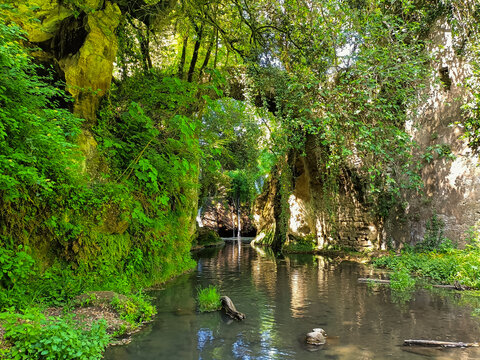 View of old bridge with river in the park of Veio, Lazio