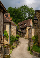 Fototapeta na wymiar narrow street with stone houses in an idyllic French country village