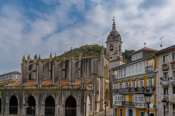 Naklejka na ściany i meble vertical view of downtown Lekeitio with the Church of Santa Maria