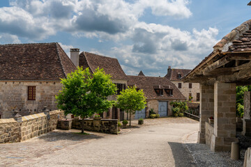 Obraz premium picturesque street with stone houses in an idyllic French country village