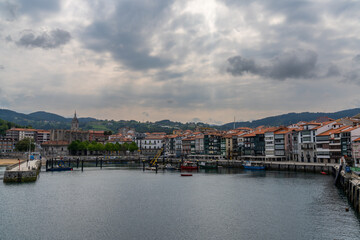 Fototapeta na wymiar view of the harbor and fishing village of Lekeitio on the coast of the Spanish Basque Country