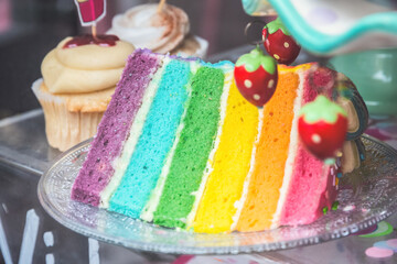 A slice of rainbow cake displayed at Brick Lane market in London