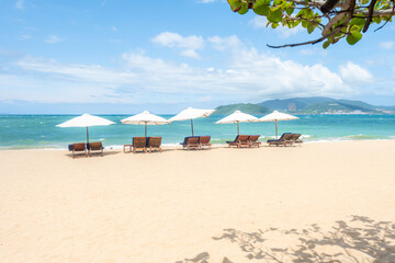 Nha Trang beach with umbrellas and chairs 