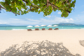 Nha Trang beach with umbrellas and chairs 
