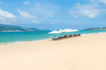 Nha Trang beach with umbrellas and chairs 