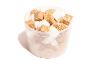 Cube of brown and white sugar in a plastic box isolated on white background