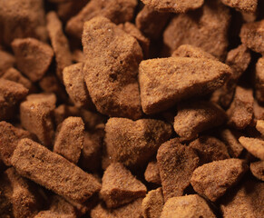 Instant coffee granules as background.