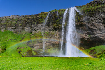 Obraz premium Waterfall in a summer day