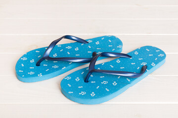 Beach accessories. Flip flops and starfish on colored background. Top view Mock up with copy space
