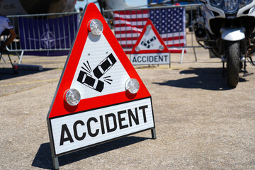 accident. traffic sign placed at the scene of a road accident, in order to warn traffic participants. photo during the day.