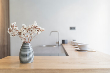 Home kitchen interior background. Counter wooden kitchen table with decor and modern design. 