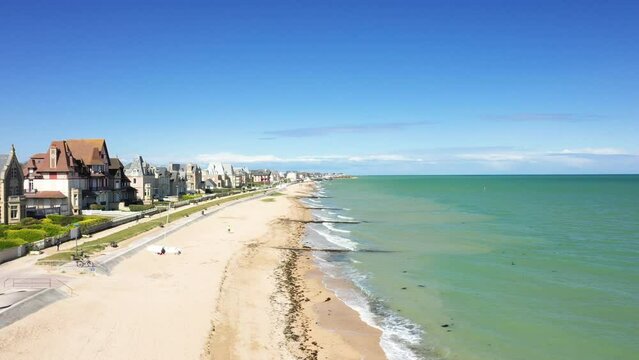 The beach by the Channel Sea at Sword beach in Europe, France, Normandy, towards Caen, Ouistreham, in spring, on a sunny day.
