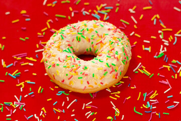 delicious donut with sweet topping and colorful chocolate sprinkles