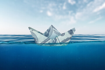 A ship made of dollar banknotes on the sea. Concept of success and investment in business