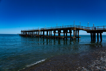 Fototapeta na wymiar iron pier on the sea