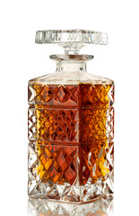 Decanter with whiskey or cognac isolated on white background