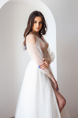 Fototapeta premium Beautiful bride perfect style. Wedding hairstyle make-up luxury wedding dress