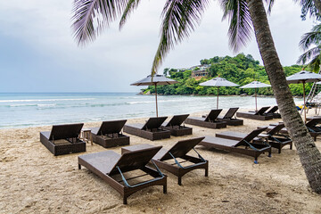 Beach Chairs in front of the sea beach - Holiday relaxation background Concept